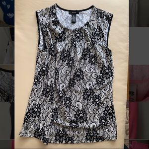 Sleeveless black and white blouse